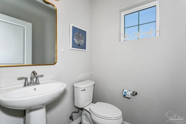 bathroom featuring sink and toilet