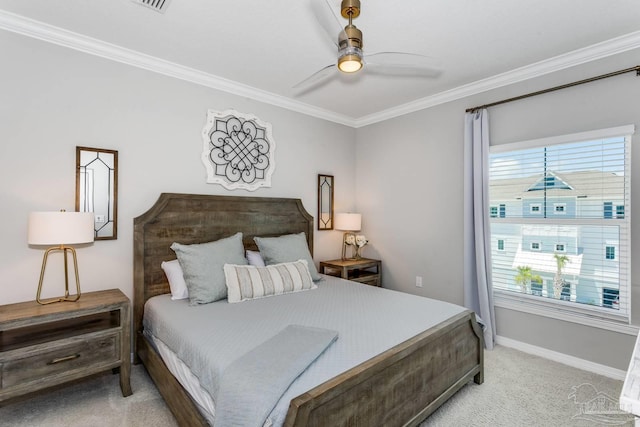 bedroom with crown molding, ceiling fan, and carpet floors