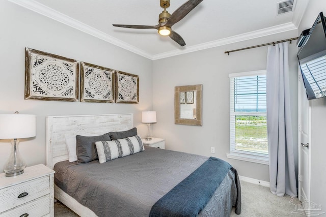 carpeted bedroom with crown molding and ceiling fan