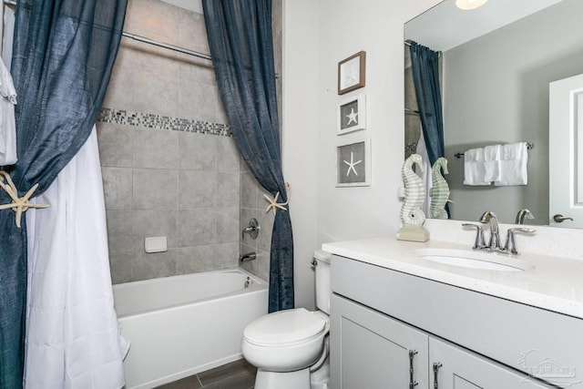 full bathroom with vanity, wood-type flooring, shower / tub combo with curtain, and toilet