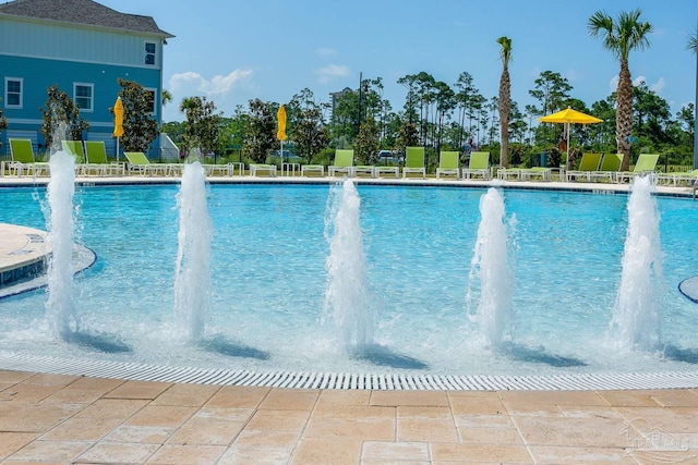 view of swimming pool featuring pool water feature