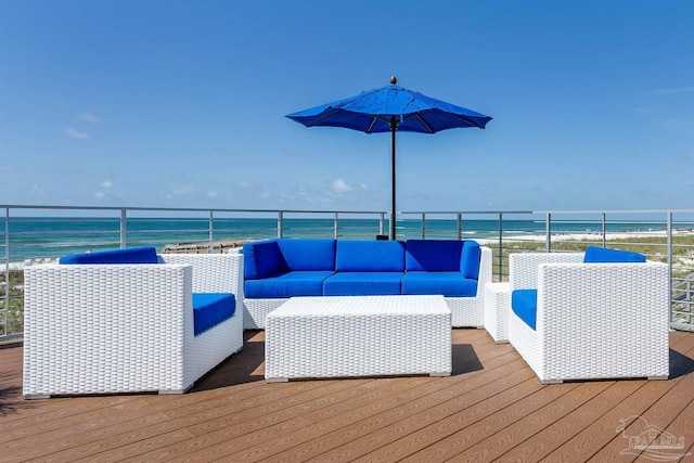 wooden deck featuring a water view and an outdoor hangout area