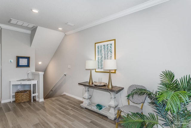 interior space featuring hardwood / wood-style floors and ornamental molding