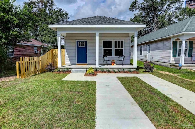 bungalow featuring a porch and a front yard