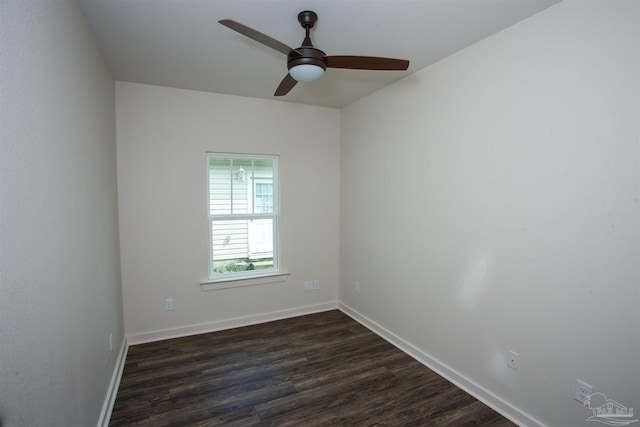 spare room with dark hardwood / wood-style floors and ceiling fan