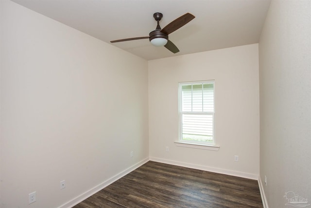 empty room with ceiling fan and dark wood-type flooring