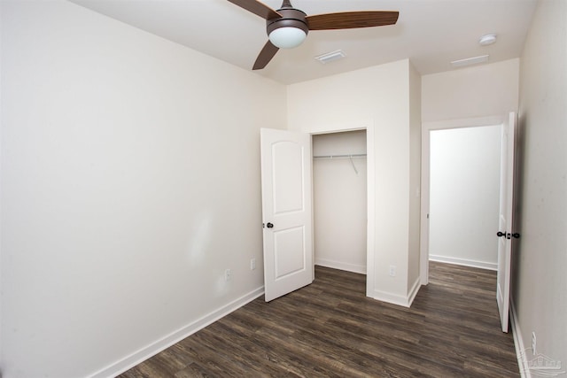 unfurnished bedroom with a closet, ceiling fan, and dark hardwood / wood-style flooring