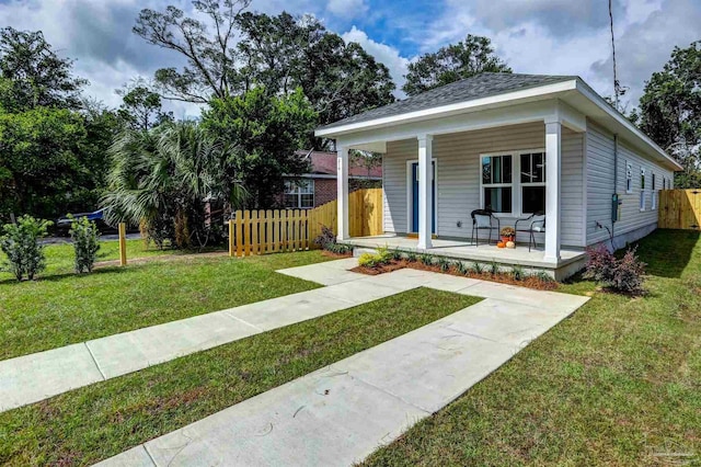 bungalow-style house with covered porch and a front yard