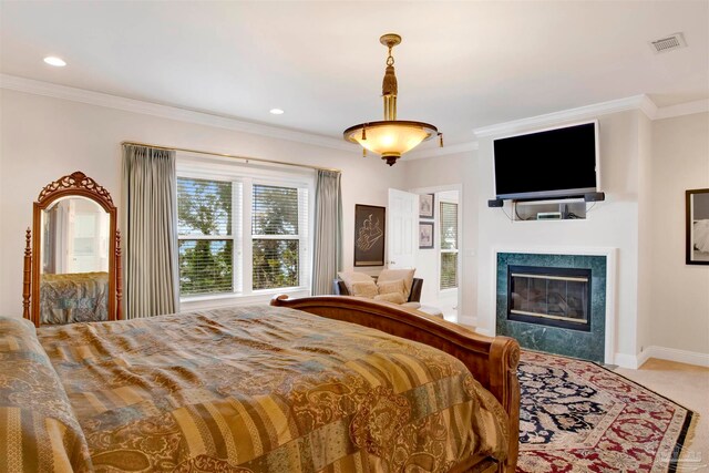 carpeted bedroom featuring crown molding