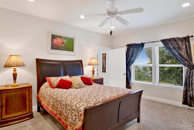 carpeted bedroom featuring ceiling fan