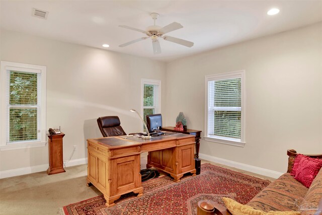 carpeted home office with ceiling fan