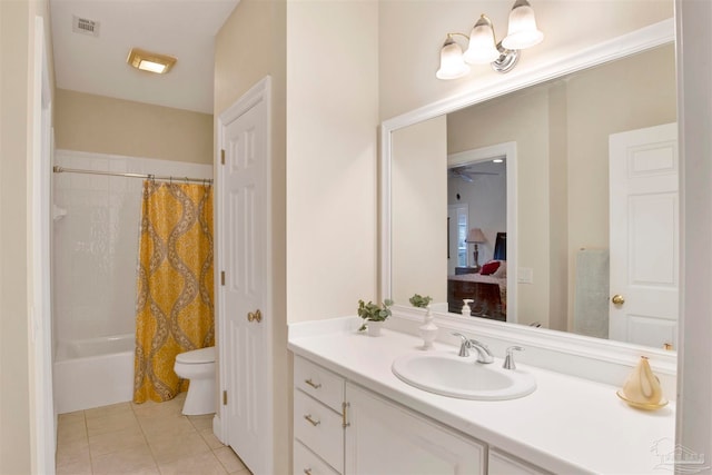 full bathroom with vanity, toilet, tile patterned flooring, and shower / tub combo