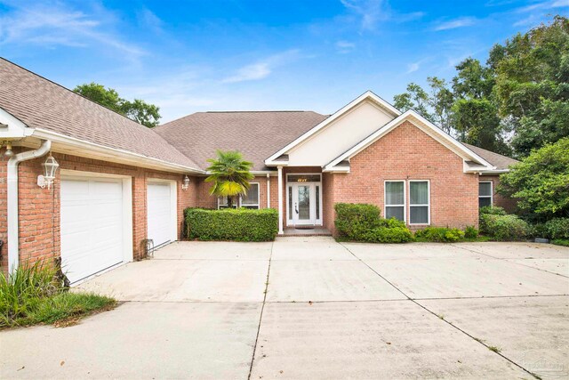 ranch-style house featuring a garage