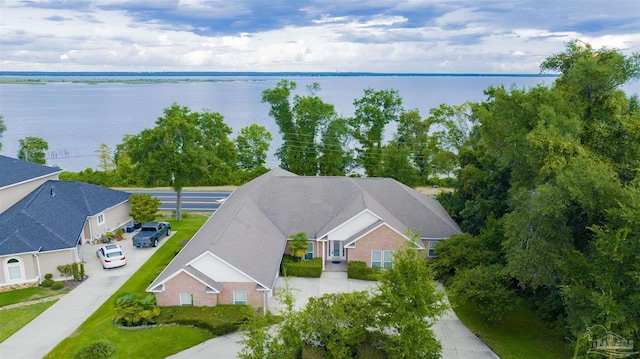 birds eye view of property with a water view