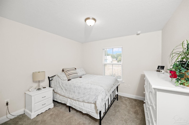 carpeted bedroom with a textured ceiling