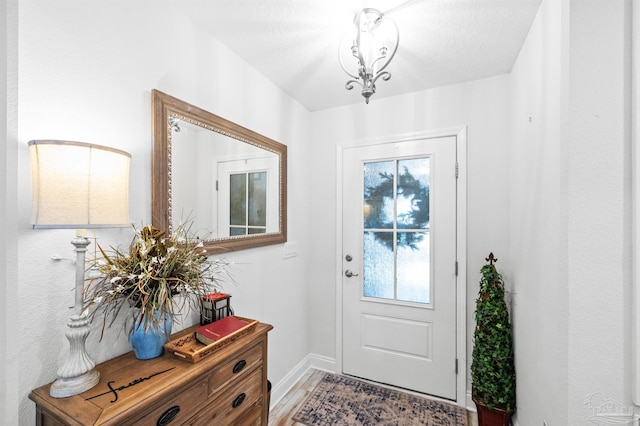 doorway to outside featuring hardwood / wood-style flooring