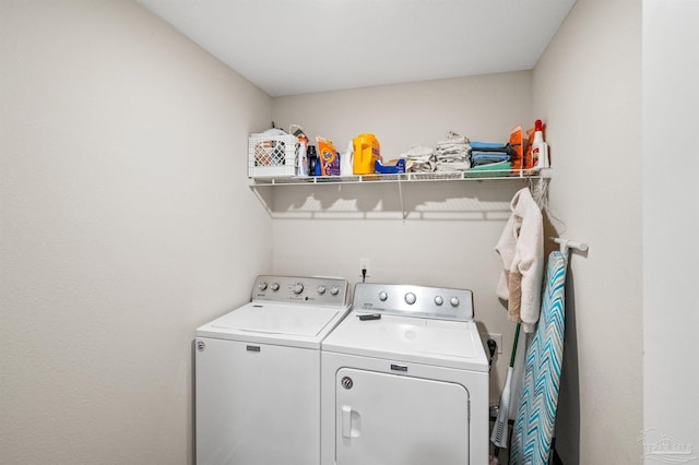 washroom with washing machine and dryer