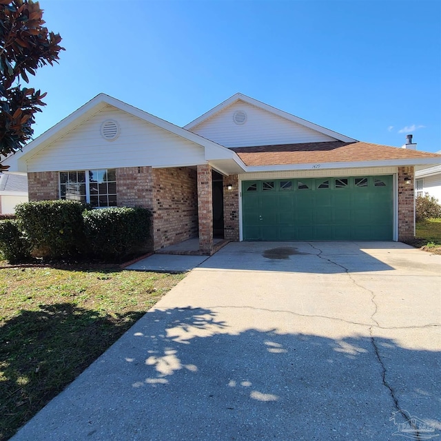 ranch-style house featuring a garage