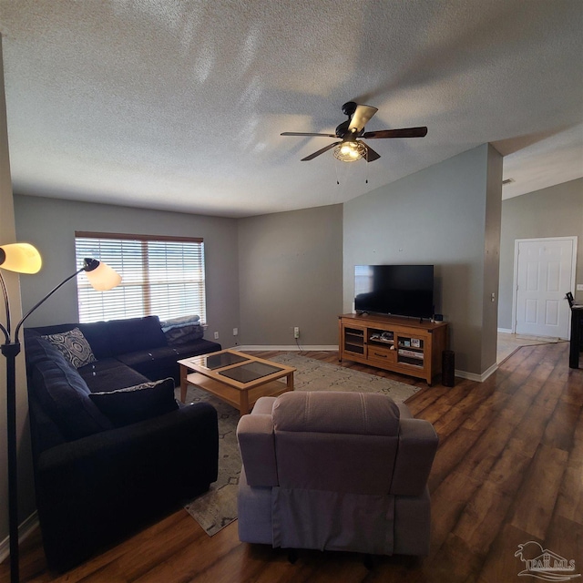 living room featuring ceiling fan, a textured ceiling, dark hardwood / wood-style flooring, and lofted ceiling