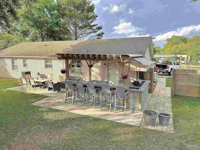 1405 College Pkwy, Gulf Breeze, FL 32563 - exterior space with fence, outdoor dry bar, a pergola, a patio area, and a yard