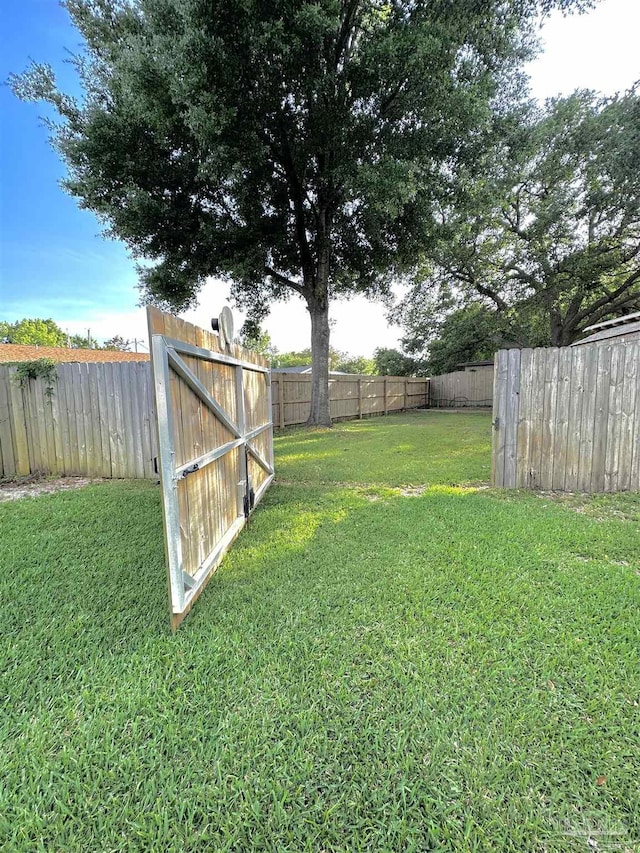 1405 College Pkwy, Gulf Breeze, FL 32563 - view of yard with a fenced backyard
