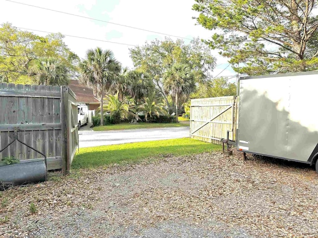 1405 College Pkwy, Gulf Breeze, FL 32563 - view of yard with a gate and fence