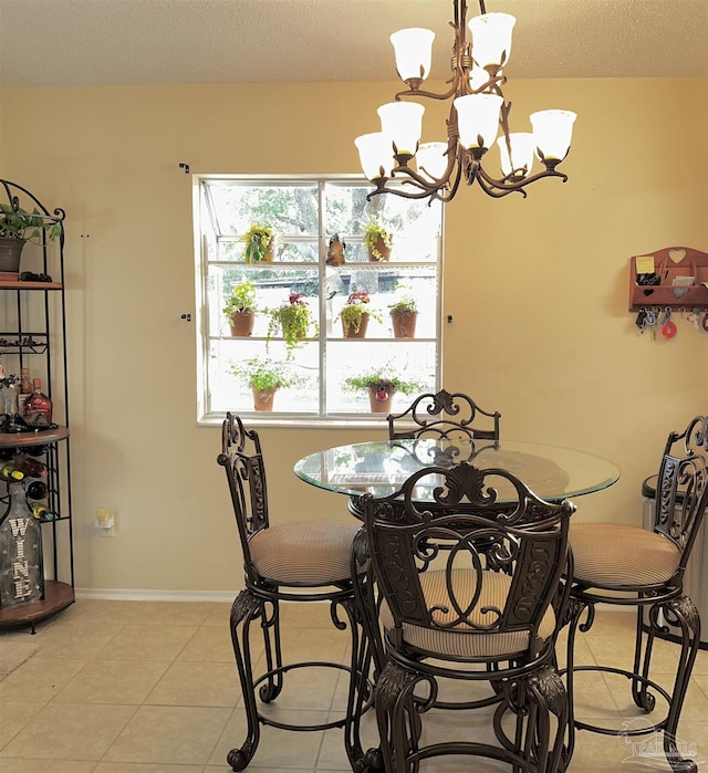 1405 College Pkwy, Gulf Breeze, FL 32563 - dining space with baseboards, light tile patterned flooring, and a notable chandelier