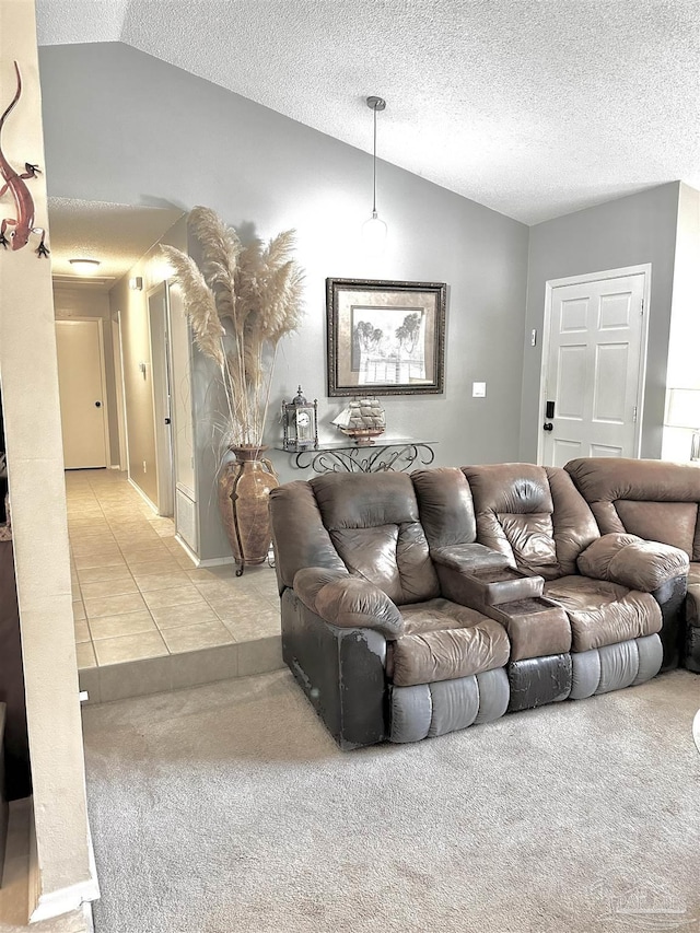 1405 College Pkwy, Gulf Breeze, FL 32563 - carpeted living area with a textured ceiling, tile patterned floors, and vaulted ceiling