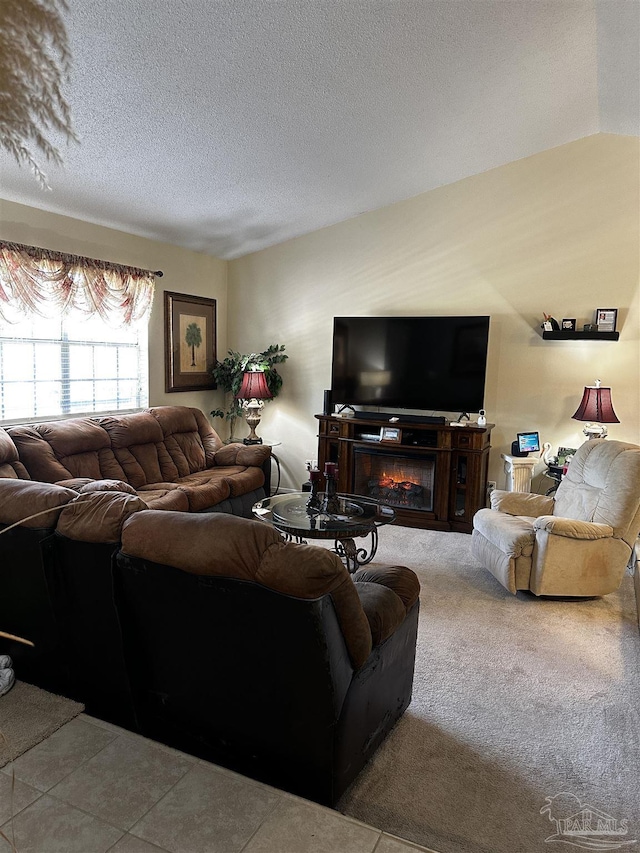 1405 College Pkwy, Gulf Breeze, FL 32563 - living room featuring a glass covered fireplace, carpet flooring, and a textured ceiling