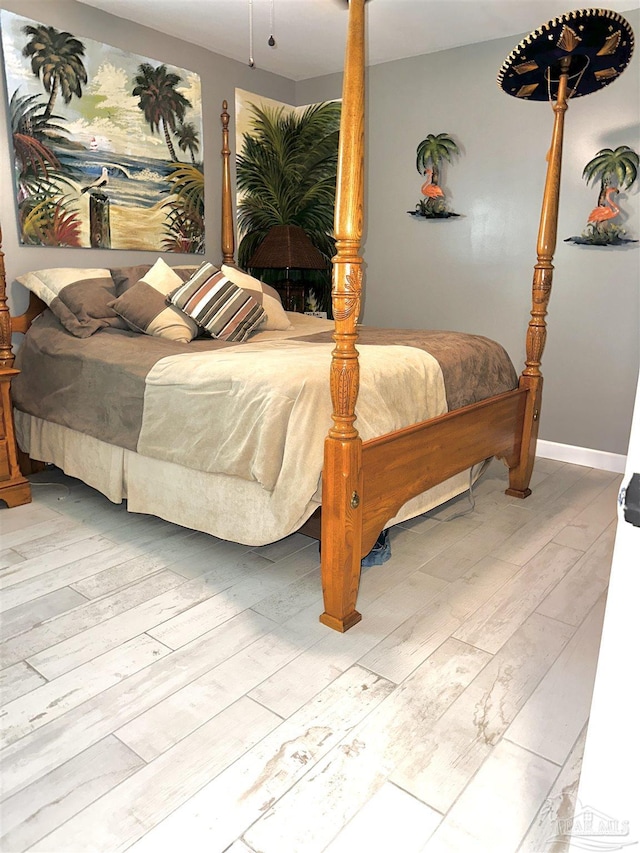 1405 College Pkwy, Gulf Breeze, FL 32563 - bedroom featuring baseboards and wood finished floors