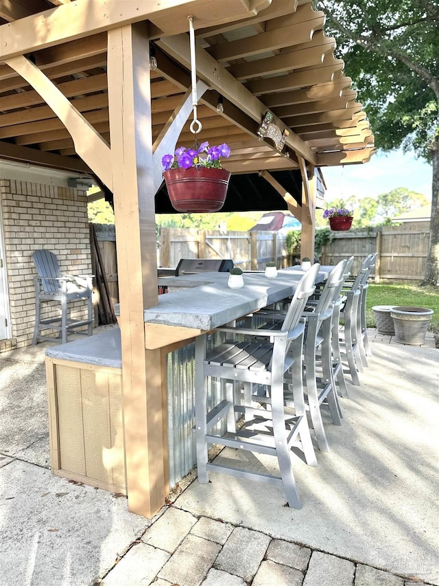 1405 College Pkwy, Gulf Breeze, FL 32563 - view of patio / terrace with a fenced backyard and outdoor dry bar