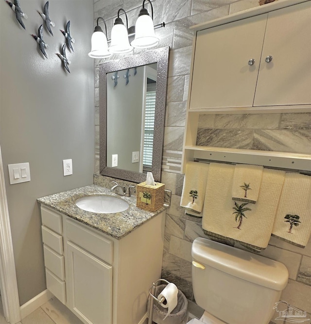 1405 College Pkwy, Gulf Breeze, FL 32563 - bathroom with toilet, baseboards, and vanity