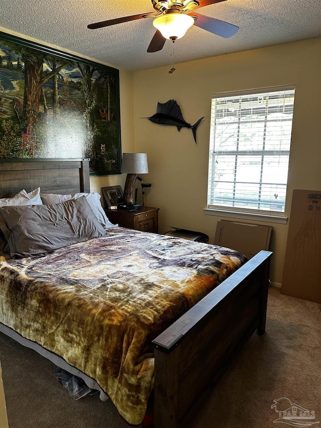 1405 College Pkwy, Gulf Breeze, FL 32563 - bedroom with a ceiling fan, a textured ceiling, and carpet