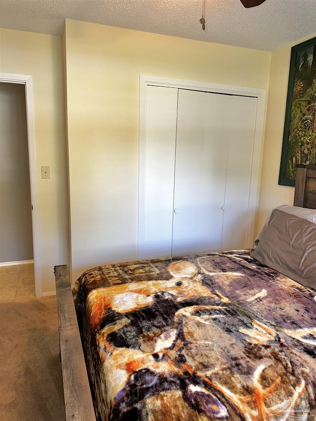 1405 College Pkwy, Gulf Breeze, FL 32563 - bedroom with a closet, carpet flooring, and a textured ceiling