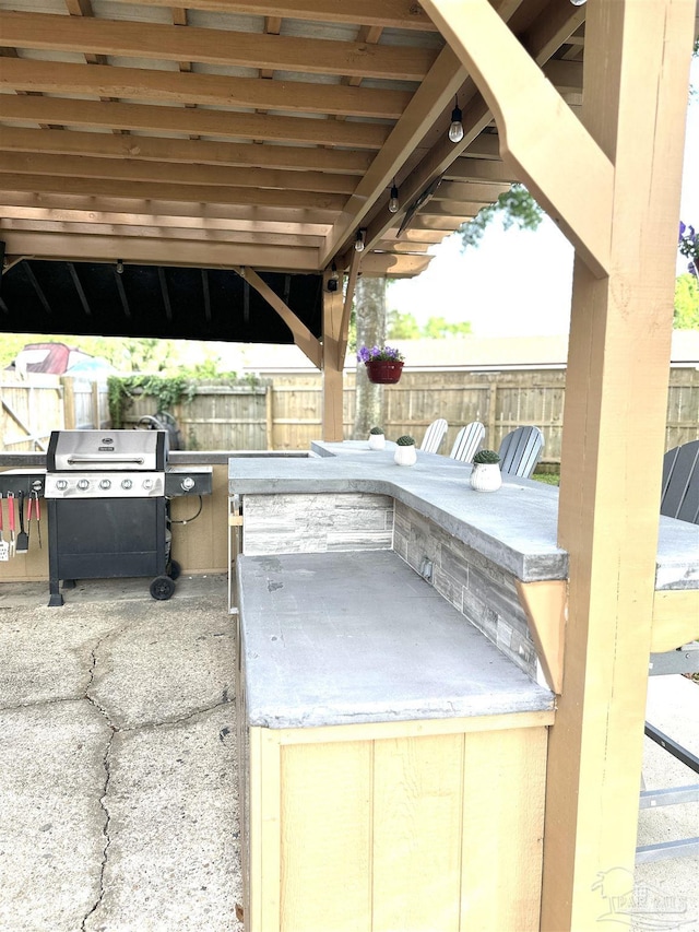 1405 College Pkwy, Gulf Breeze, FL 32563 - view of patio / terrace with a fenced backyard and area for grilling