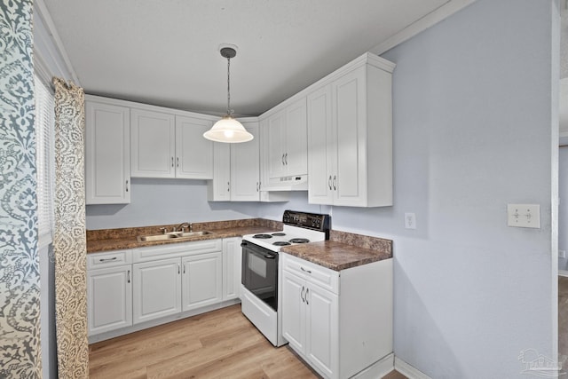 kitchen featuring a sink, electric range, dark countertops, and white cabinetry