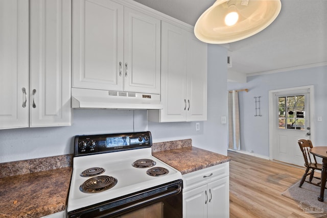 kitchen with light wood finished floors, electric stove, under cabinet range hood, white cabinetry, and dark countertops