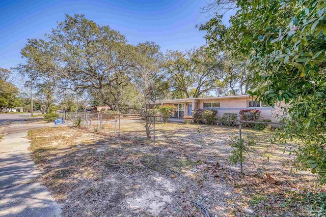 view of front of home featuring a fenced front yard and a gate