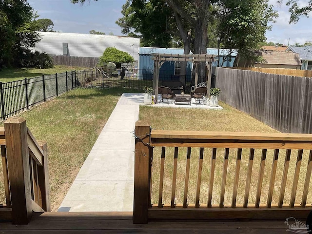 view of yard featuring a fenced backyard, a patio, and a fire pit
