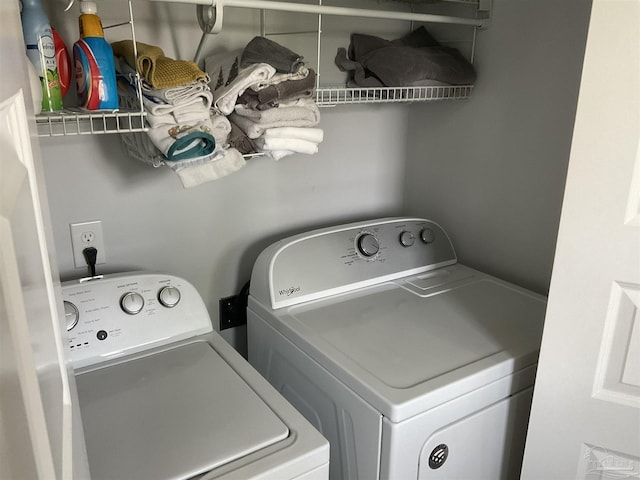 clothes washing area with laundry area and washing machine and dryer