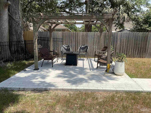 view of patio with a fenced backyard, an outdoor fire pit, and a pergola