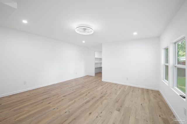 spare room with light hardwood / wood-style floors