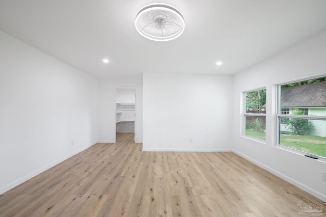 empty room with light hardwood / wood-style floors