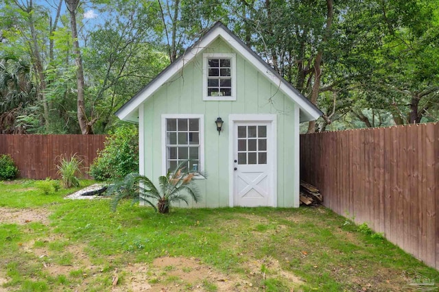 view of outbuilding with a lawn