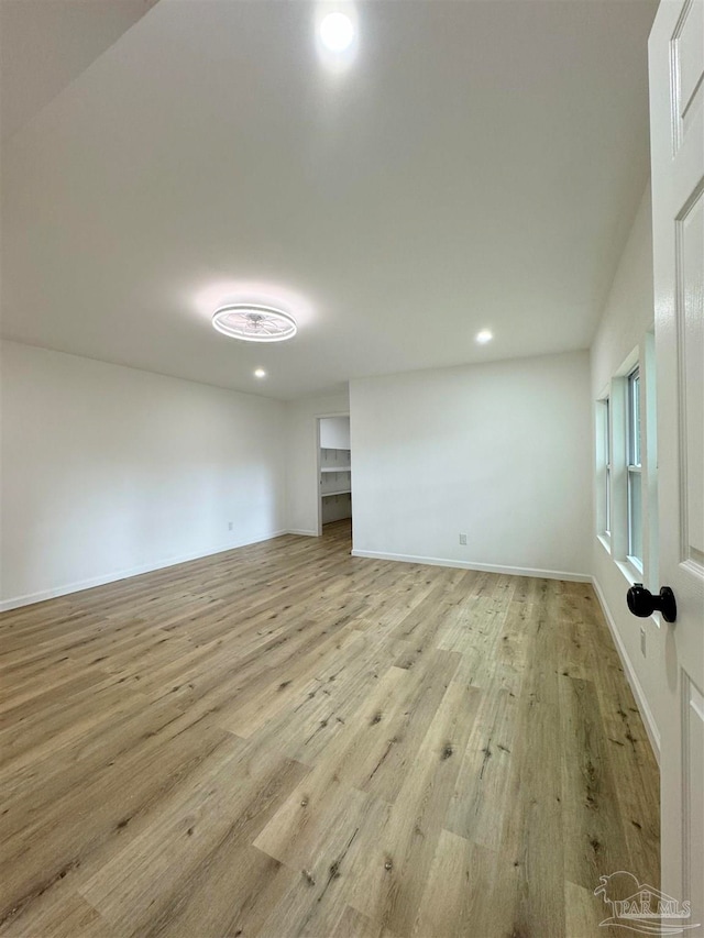 unfurnished room featuring light hardwood / wood-style floors