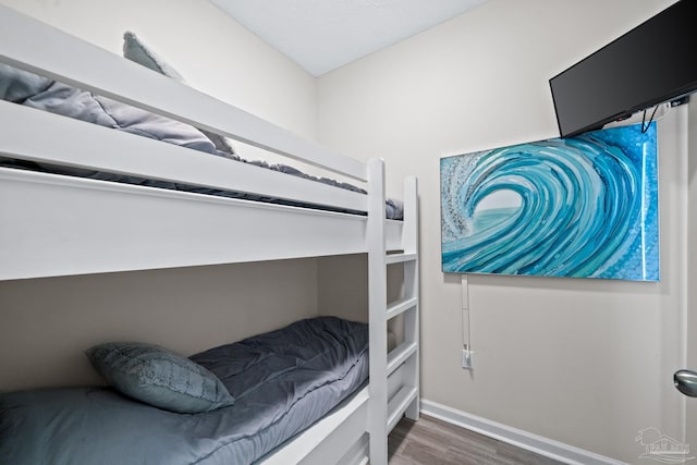 bedroom featuring dark hardwood / wood-style flooring