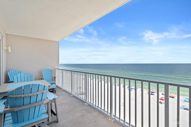 balcony with a view of the beach and a water view