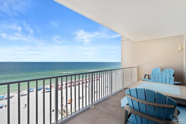 balcony with a view of the beach and a water view