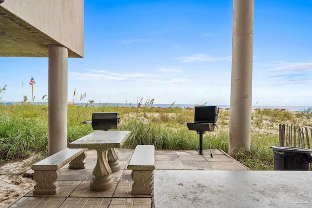 view of patio / terrace with a water view