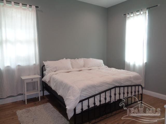 bedroom featuring hardwood / wood-style flooring